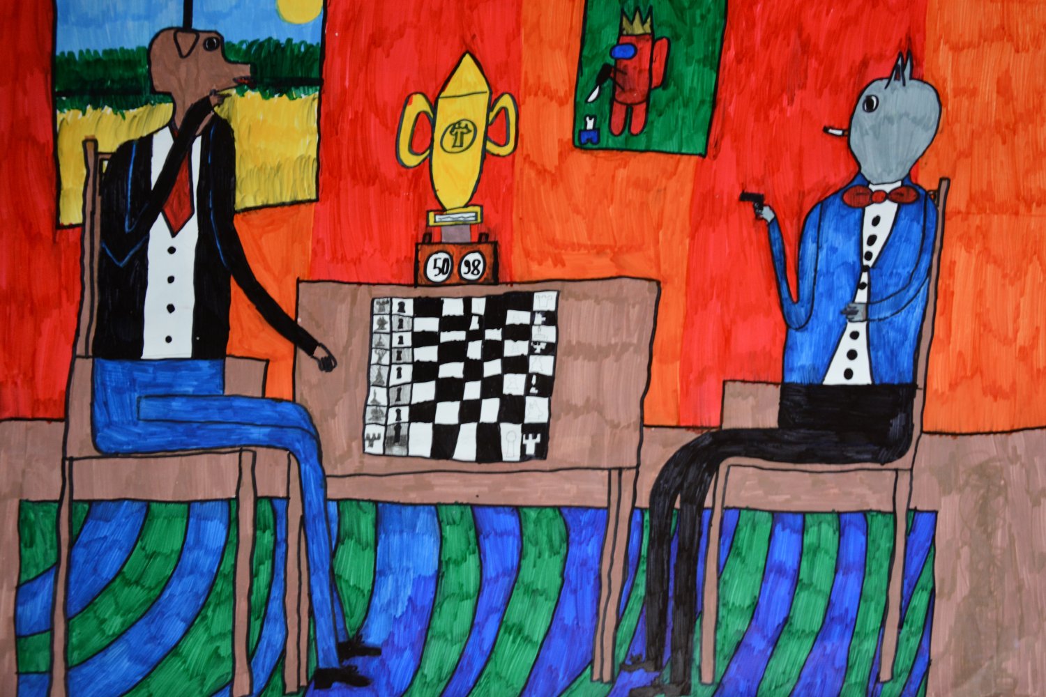I miejsce: Jan Choniawko. 10 lat. Tytuł “Zwierzoludzie i szachy”. Piękna i kolorowa kompozycja przedstawia zwierzęta o cechach ludzkich, które grają w szachy. Technika flamaster na papierze.